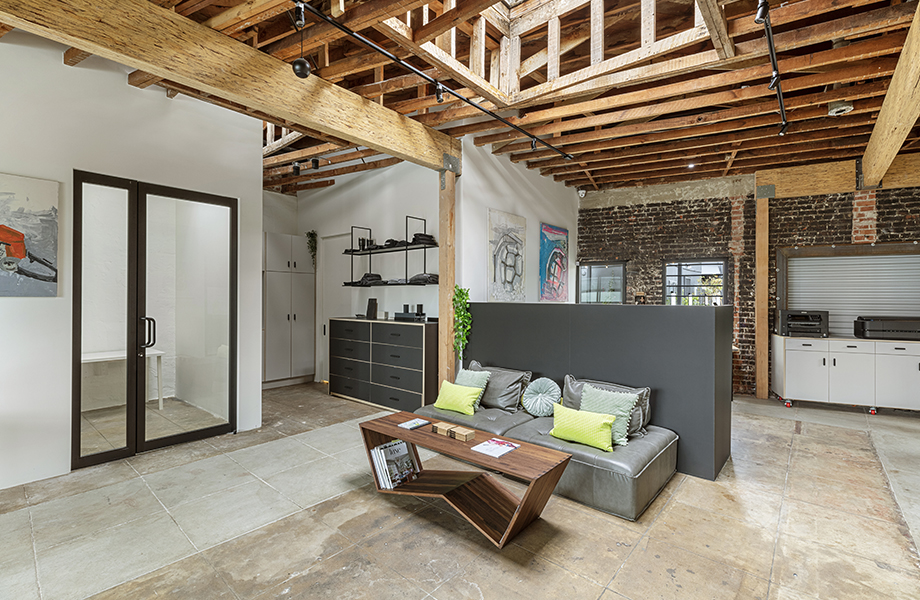 Office interior with exposed floor and beams