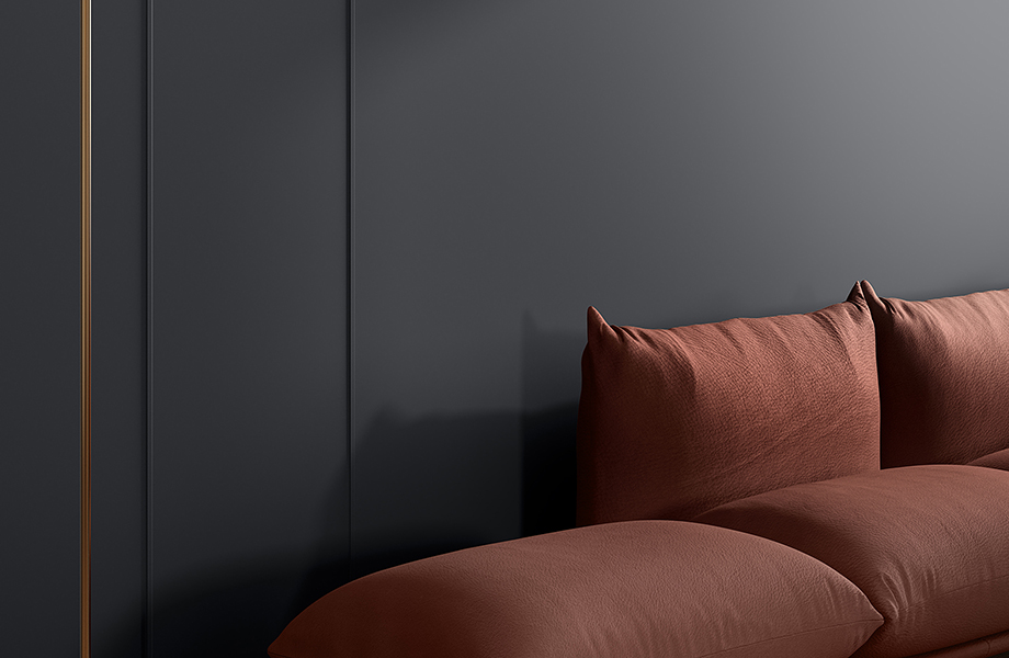 A couch with FENIX X-KIN wall covering behind it