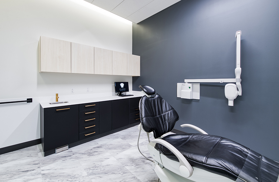Floss Dentistry exam room with dentist treatment chair and black and white cabinets