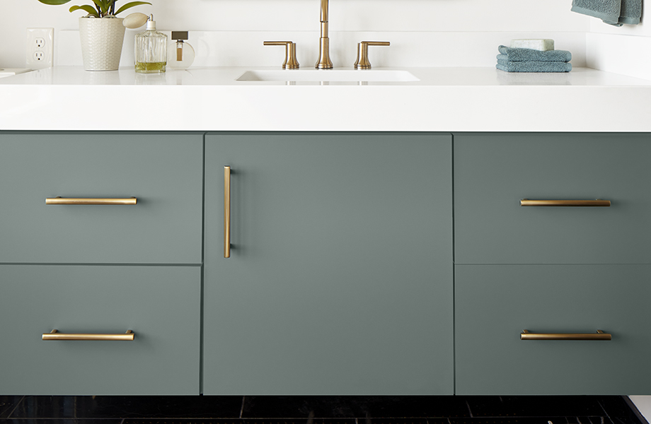 FENIX Verde Comodoro super-matte bathroom cabinet with white countertop and gold fixtures