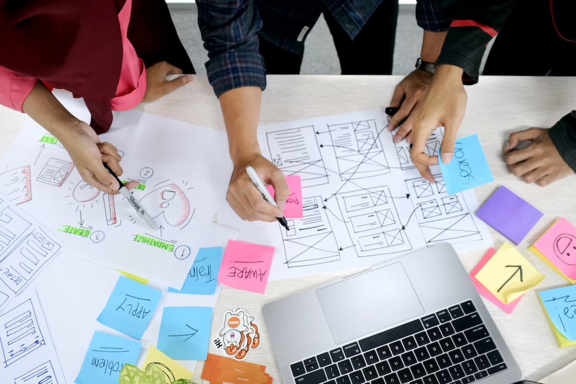 three people planning experience design