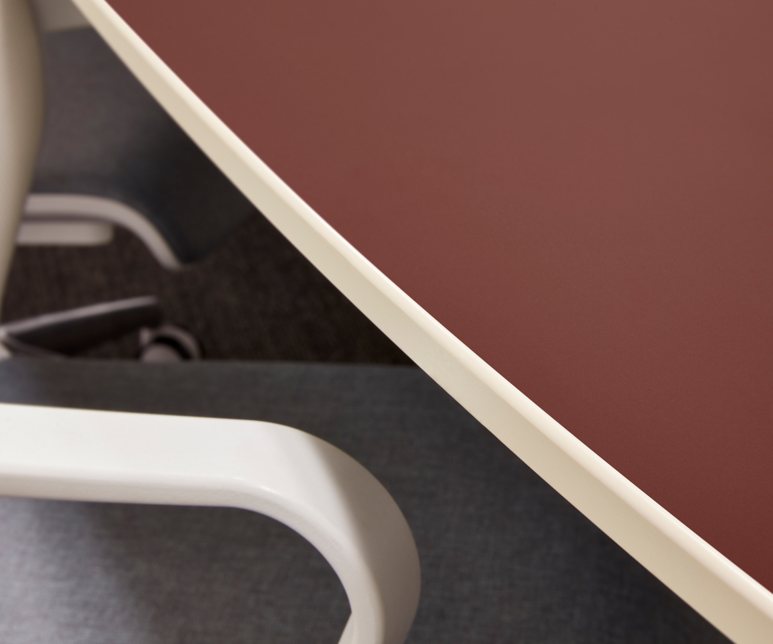 FENIX NTM Rosso Jaipur makes for a sleek meeting room table, with a slight hint of added color.